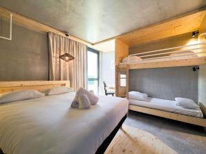 a bedroom with two bunk beds and a desk at greet hotel Cernay Mulhouse in Cernay +66 photos