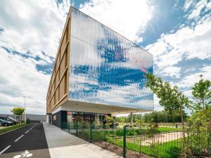 a building with a large mural on the side of it at greet hotel Cernay Mulhouse in Cernay