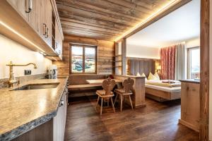 Ένα ή περισσότερα κρεβάτια σε δωμάτιο στο Hotel Garni Ransburgerhof