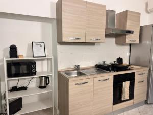 Kuchyň nebo kuchyňský kout v ubytování Sant Alessandro centralissimo Bilocale