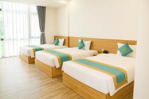 Ένα ή περισσότερα κρεβάτια σε δωμάτιο στο Sala Home Móng Cái +20 φωτογραφίες