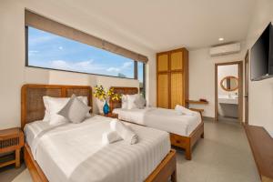 Postel nebo postele na pokoji v ubytování MH Boutique Villa An Bàng + 63 fotografií