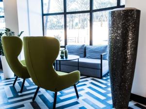 Χώρος καθιστικού στο Mercure Roma Cinecittà