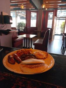 a plate of food on a table with food on it at Big Spoon Cafe in Eldoret