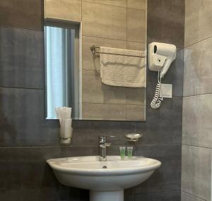 a bathroom with a sink and a mirror at Prime Hotel Vayk at Lider Complex in Vaykʼ +58 photos