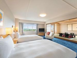 Postel nebo postele na pokoji v ubytování Mercure Fukuoka Munakata Resort & Spa