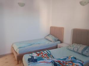 Postel nebo postele na pokoji v ubytování taguermess 2