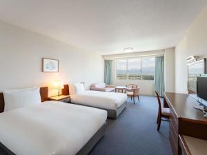 Postel nebo postele na pokoji v ubytování Mercure Nagano Matsushiro Resort & Spa + 116 fotografií