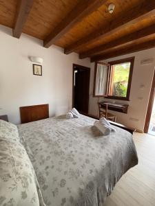 Ένα ή περισσότερα κρεβάτια σε δωμάτιο στο Agriturismo Verde Friuli