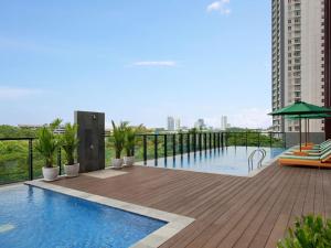 a swimming pool on the roof of a building at ibis Styles Serpong BSD City in Tangerang