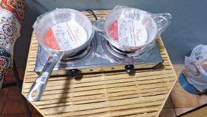 a table with two bowls in plastic covers on it at Centre point Aswan in Aswan