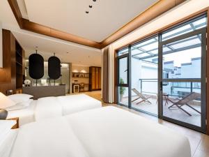 Ένα ή περισσότερα κρεβάτια σε δωμάτιο στο Floral Shemanyue Mountain Homestay