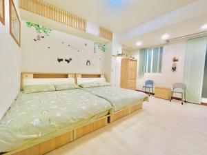 a bedroom with a bed in a room at Lohas-artist B&B in Chaozhou