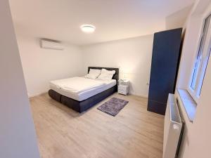 Voodi või voodid majutusasutuse Modernes Haus direkt am Rhein toas