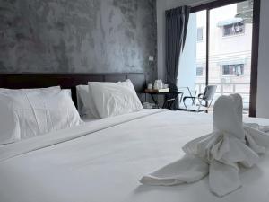 Ένα ή περισσότερα κρεβάτια σε δωμάτιο στο The Sense