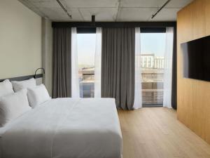 Giường trong phòng chung tại Pullman Zagreb +58 ảnh