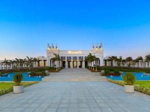 a resort with a staircase leading up to a building at Rixos Radamis Sharm El Sheikh in Sharm El Sheikh
