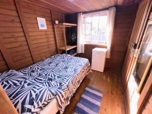 Ένα ή περισσότερα κρεβάτια σε δωμάτιο στο Oka do Mar Hospedaria - Suíte com varanda na Ilha do Mel - Nova Brasília