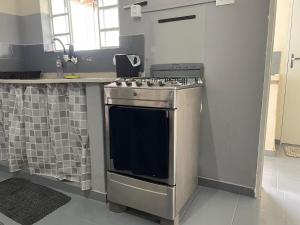 Una cocina o cocineta en Casa aconchegante próximo ao parque ecológico