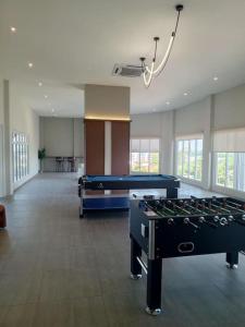 a large room with two pool tables in it at AL Homestay with 3 Bedrooms in Alor Setar