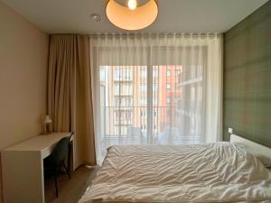 Postel nebo postele na pokoji v ubytování Appartement moderne 2 chambres & 2 parking à Koksijde by La Conciergerie