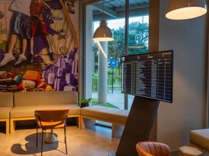 Χώρος καθιστικού στο Ibis Budget Guarulhos Aeroporto