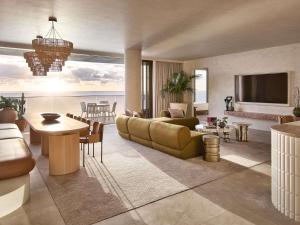 a living room with a couch and a table at Mondrian Gold Coast in Gold Coast