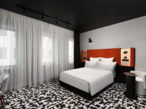 Ένα ή περισσότερα κρεβάτια σε δωμάτιο στο TRIBE Budapest Airport +191 φωτογραφίες