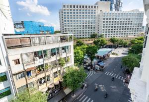 an aerial view of a city with tall buildings at LeParc Hotel - Ben Thanh Market in Ho Chi Minh City