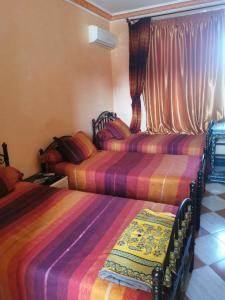 Una cama o camas en una habitación de Motel Tizint