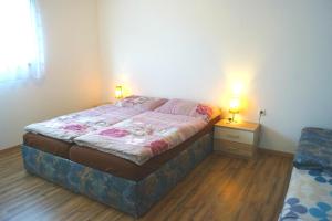 Posteľ alebo postele v izbe v ubytovaní Apartments Grebenec