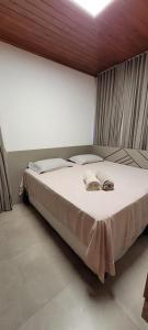 En eller flere senge i et værelse på Casa Vila Tamarindo Barra Grande