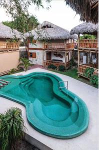 Swimmingpoolen hos eller tæt på Casa Vila Tamarindo Barra Grande
