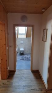 a bathroom with a toilet and a window at NEU Apartment Antonia - Ferienglück Allgäu in Lachen