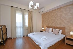 Ένα ή περισσότερα κρεβάτια σε δωμάτιο στο Lavelo Apartments