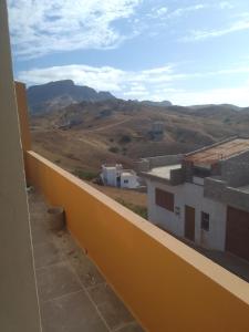 a view of the mountains from a balcony of a building at Ma maison de cha de marhina in Mindelo