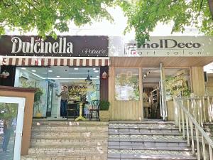 a store front of a mall with a sign on it at Apartment in City Center, street Banulescu Bodoni 57 in Chişinău