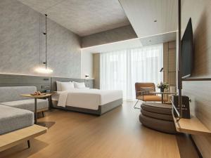 Ένα ή περισσότερα κρεβάτια σε δωμάτιο στο Novotel Yinchuan Lanxigu