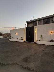 a building with a parking lot in front of it at albaha harmony resort in Al Baha