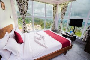 Voodi või voodid majutusasutuse Tulips Valley View Resorts toas