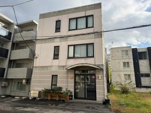 a building with a door in front of it at Mori Sapporo in Sapporo