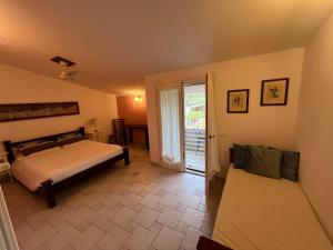 Ένα ή περισσότερα κρεβάτια σε δωμάτιο στο B&B Rossofiore