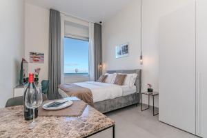 Кровать или кровати в номере Alta Marea Apulia sea view