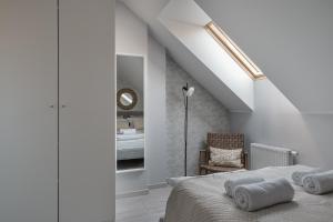 Ένα ή περισσότερα κρεβάτια σε δωμάτιο στο Apartament Sauna Loft