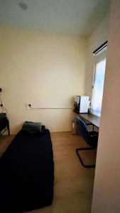 a room with a desk and a computer in it at D Cloud Homestay & Room in Kajang +145 photos