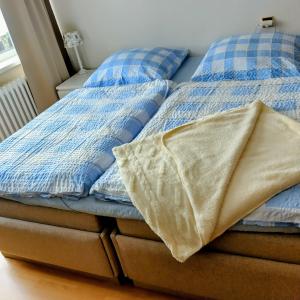 Ένα ή περισσότερα κρεβάτια σε δωμάτιο στο Penzion Frederika