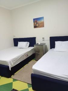 A bed or beds in a room at NEW Hostel pyramids Még 23 kép