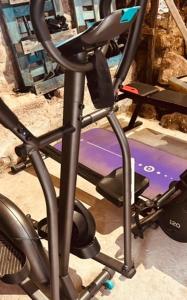 a gym equipment with a treadmill in a room at Casa Rural en BRAÑOSERA in Brañosera
