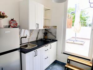 Η κουζίνα ή μικρή κουζίνα στο Italiana Hogares +16 φωτογραφίες