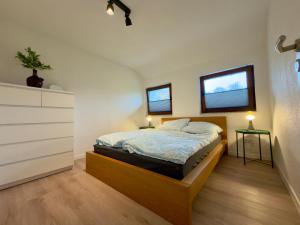 Postel nebo postele na pokoji v ubytování Ferien im Schwarzwald Dörlinbach II